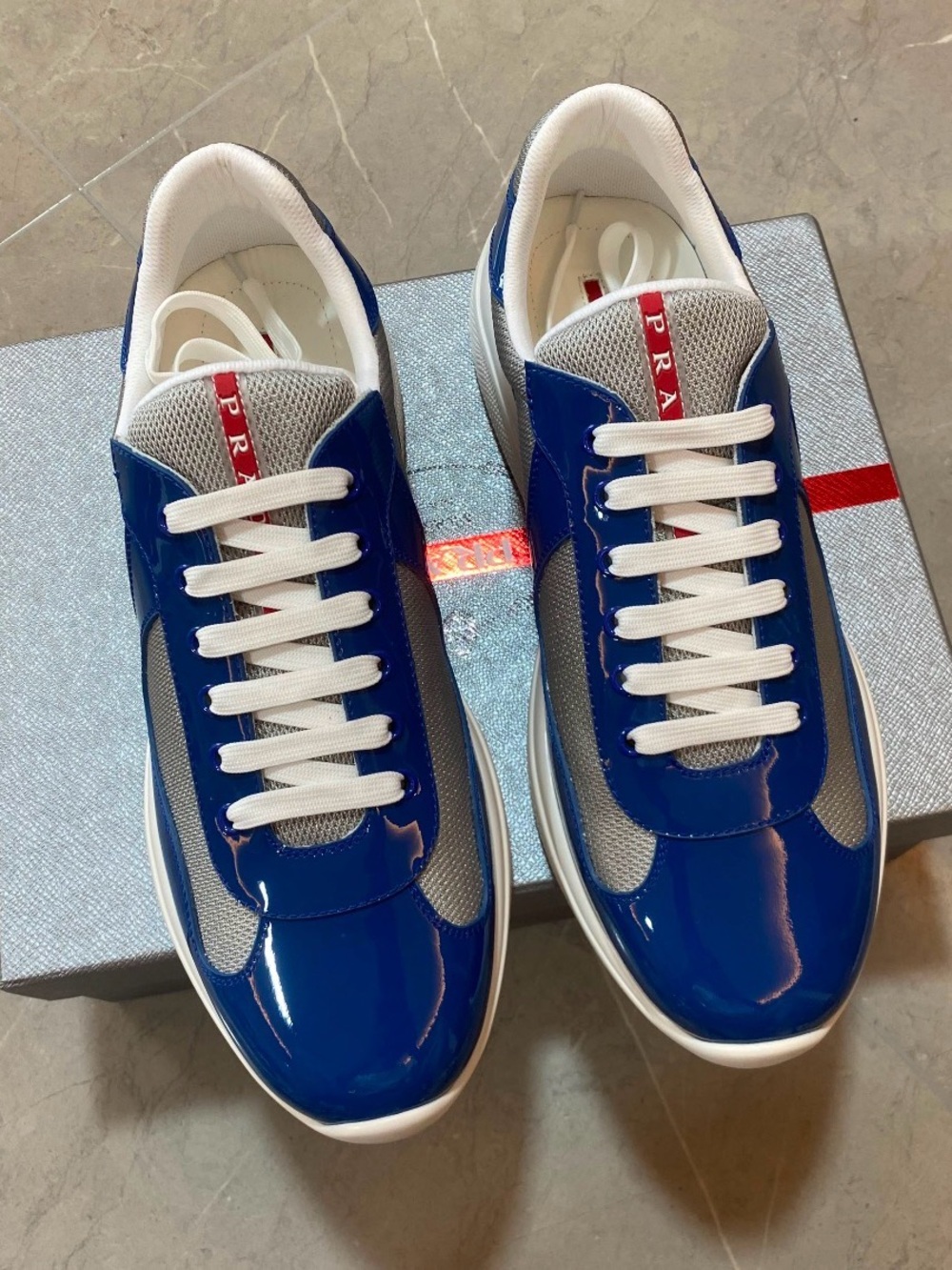 Prada Men’s Glossy Blue & White Low-Top Sneakers